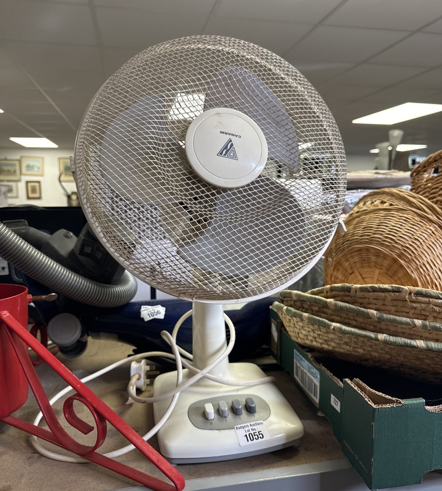White vintage Canarm desk fan with three speed settings.