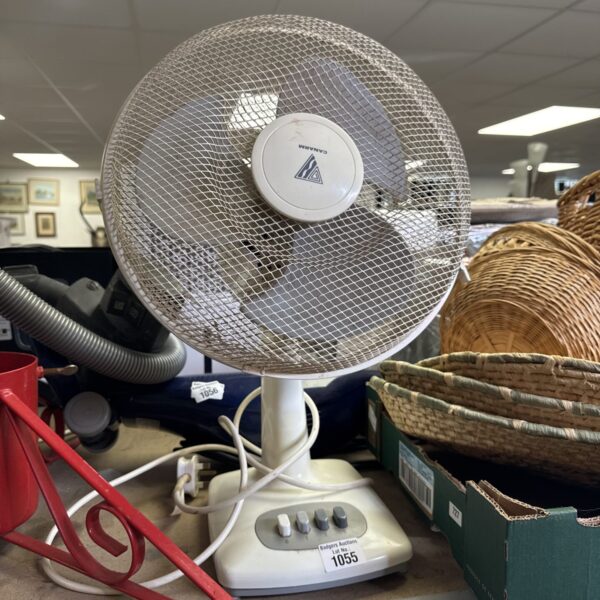 White vintage Canarm desk fan with three speed settings.