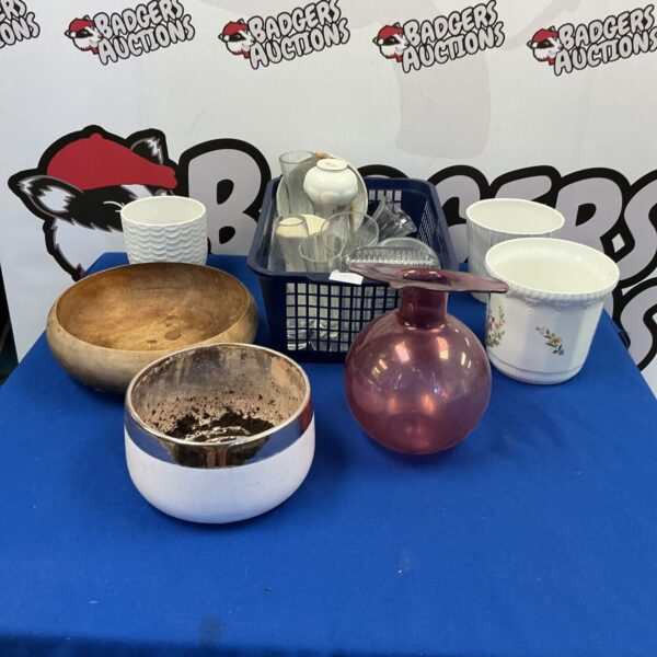 Assorted ceramic flower pots and vases for home decor.
