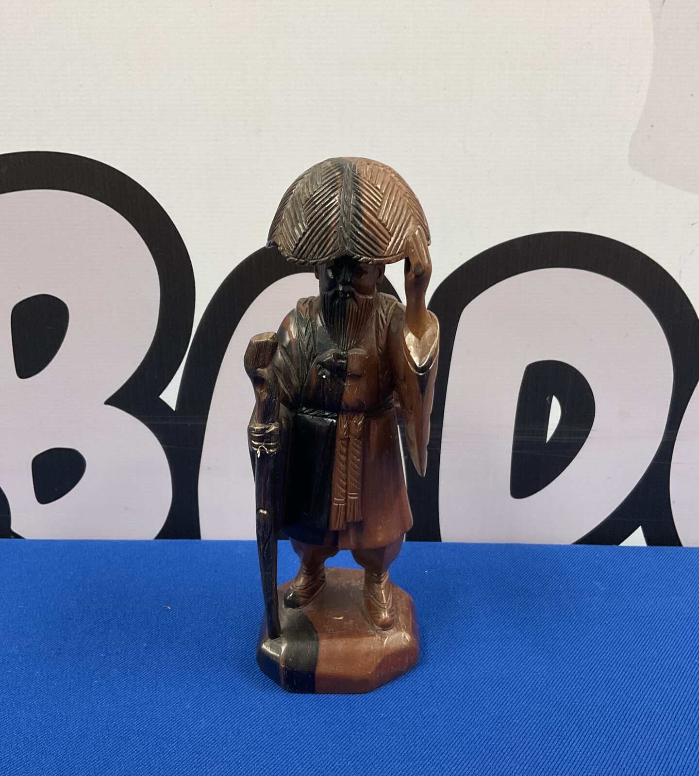 Vintage Chinese carved hardwood figure of a travelling man.