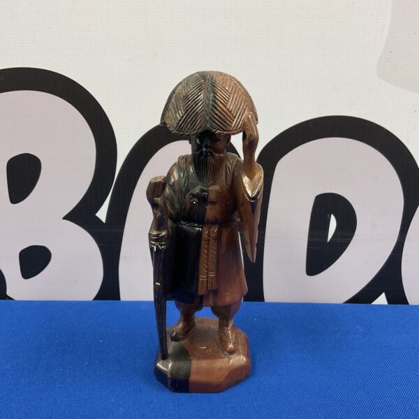 Vintage Chinese carved hardwood figure of a travelling man.