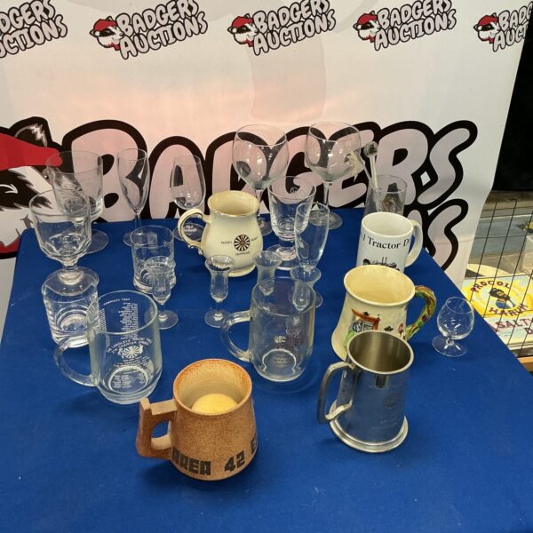 Collection of commemorative glass tankards, including Round Table designs.
