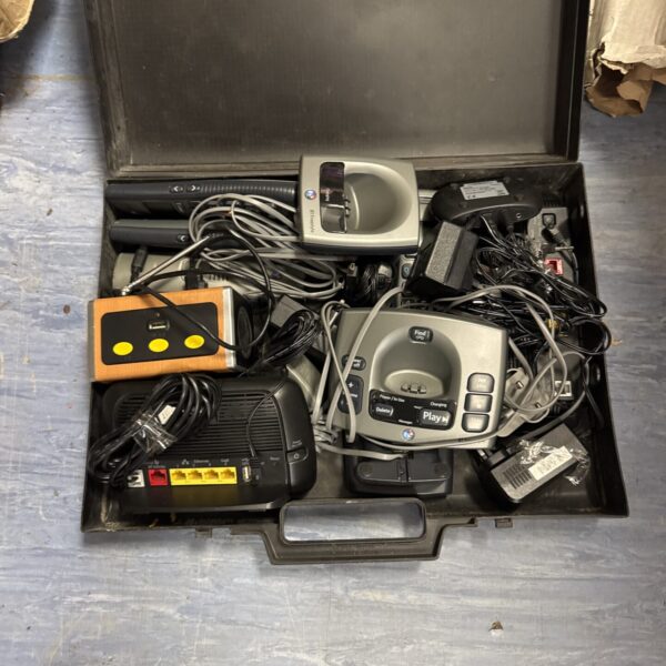 Vintage cordless phone lot with routers and speaker for collectors.