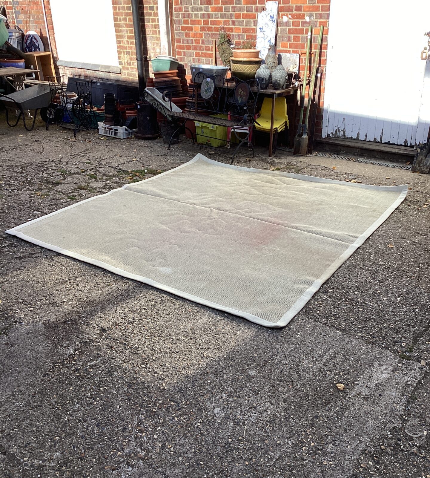 Large cream Crucial Trading rug for living room comfort.