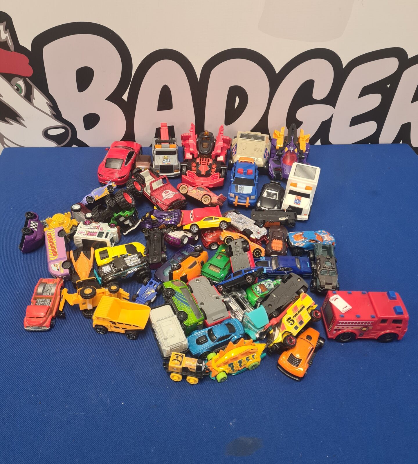 Large lot of mixed diecast toy cars and vehicles.