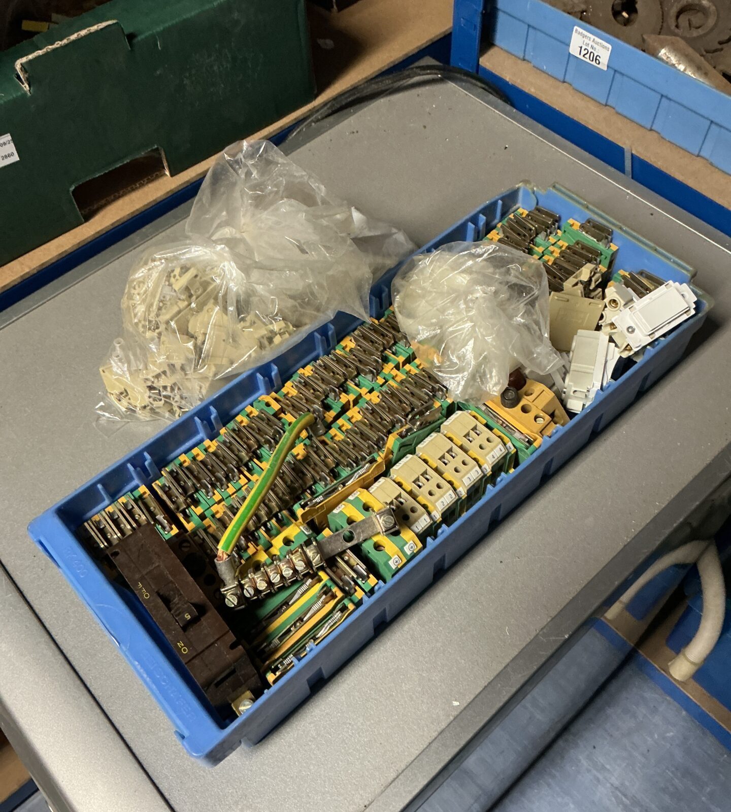 Tray of assorted electrical connector blocks for wiring projects.