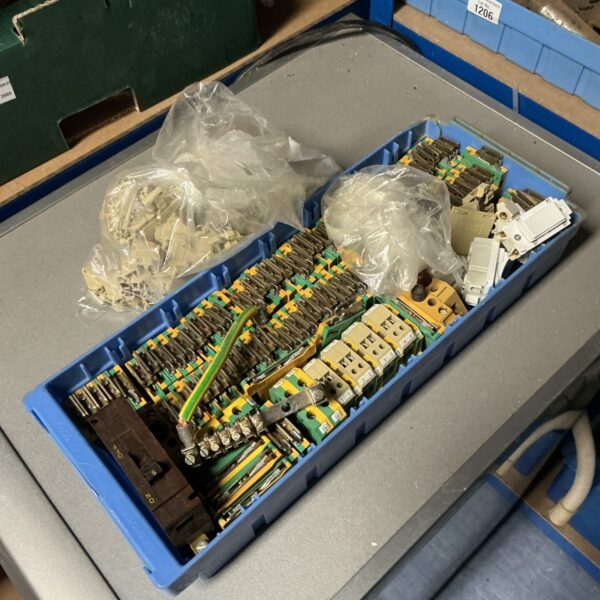 Tray of assorted electrical connector blocks for wiring projects.
