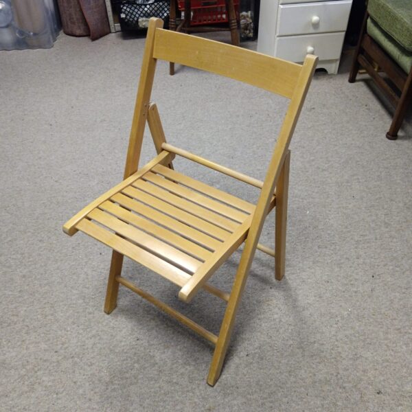 Vintage folding wooden chair with lattice seat and back.