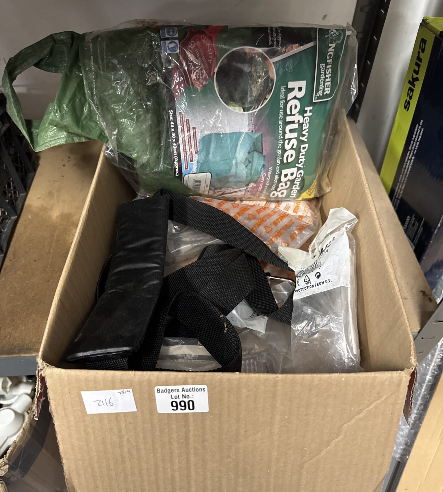 Garden clearance lot with heavy duty bag and safety goggles.