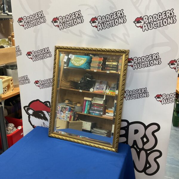 Gold framed bevel edge mirror, 26x21 inches, vintage style.