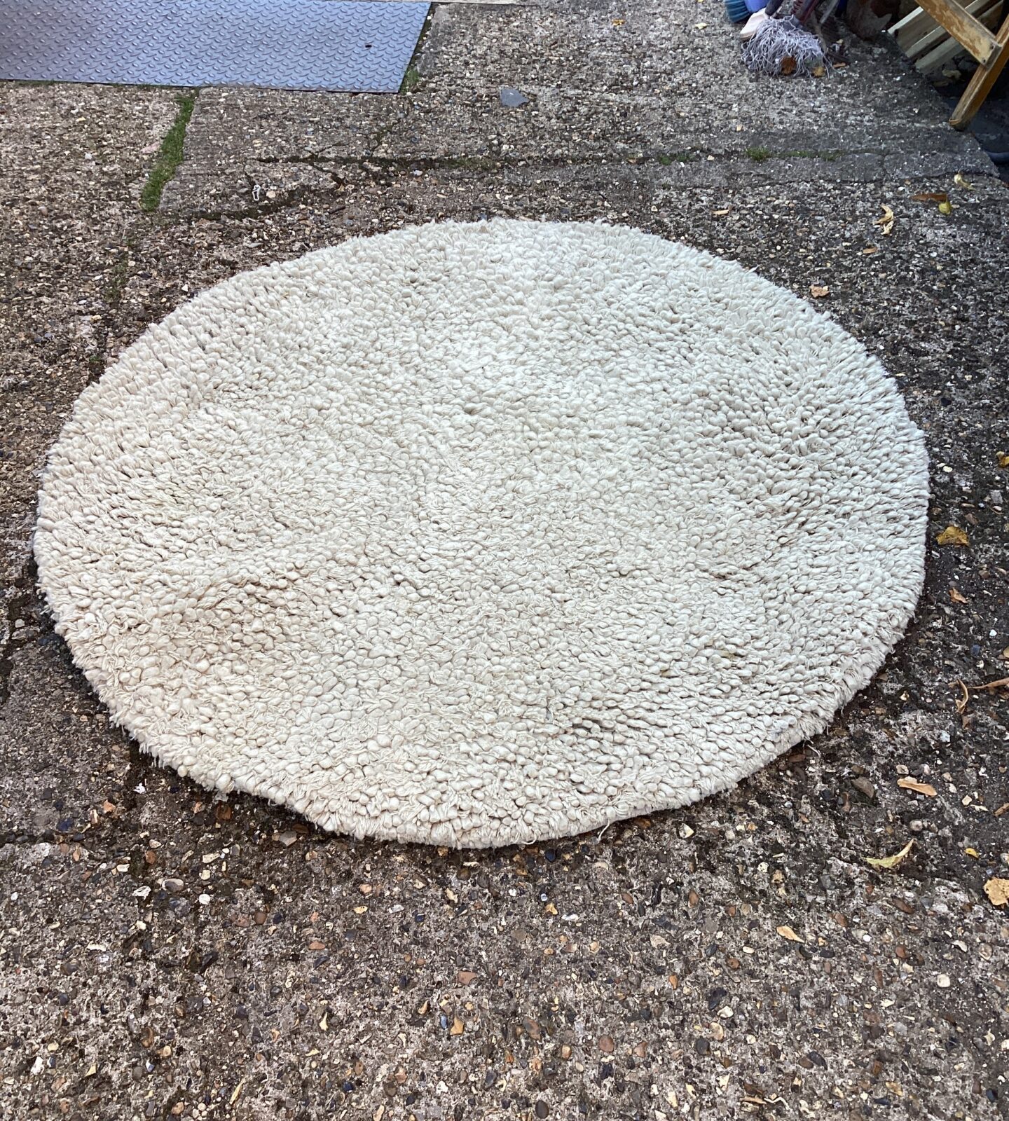 Soft grey round shagpile rug for comfortable home decor.