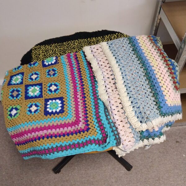 Colourful hand knitted blanket throw and mat lot.