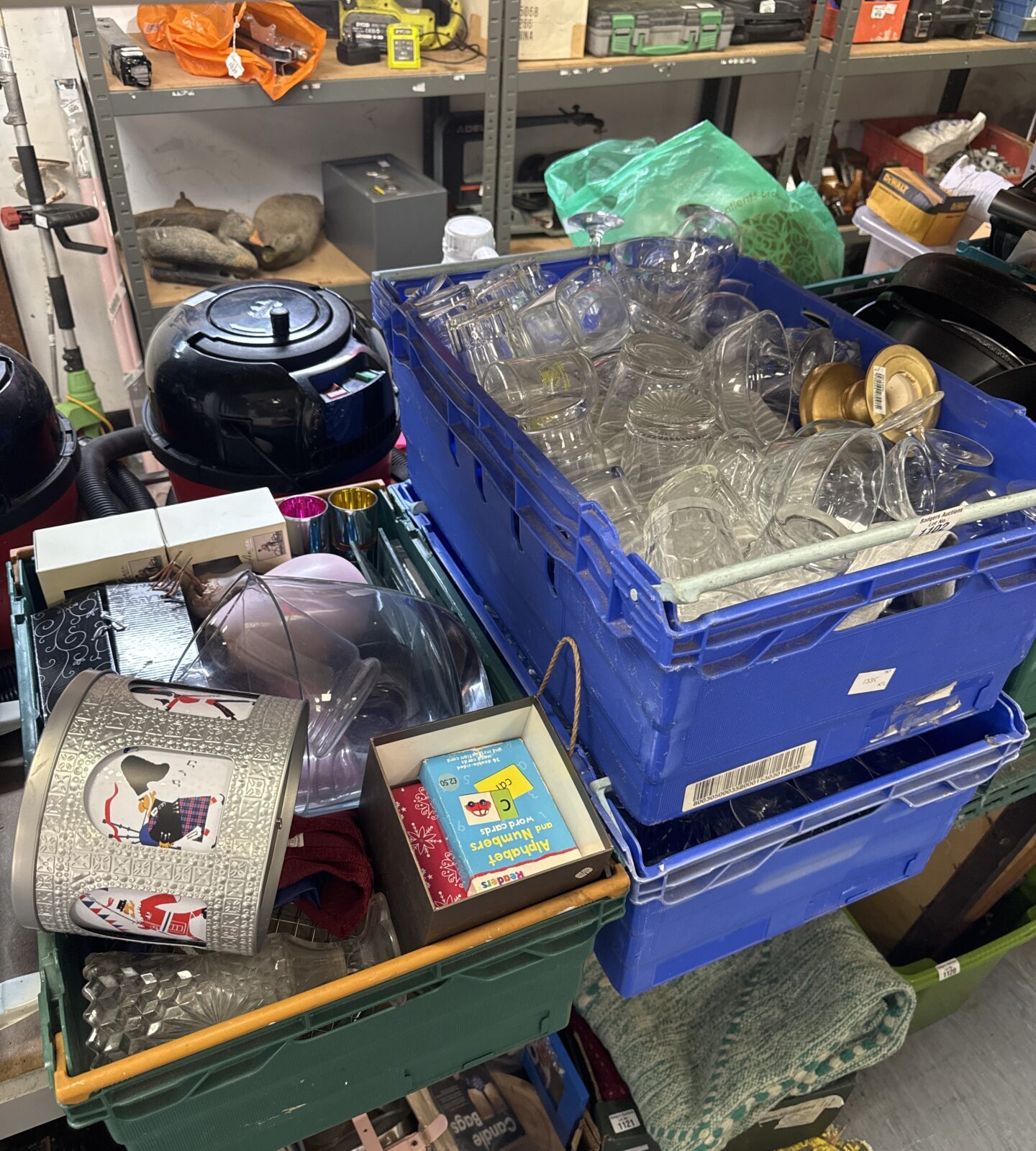 House clearance lot with three crates of assorted items.