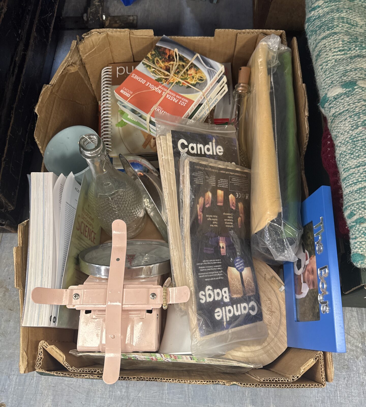 Mixed house clearance lot with vintage magazines and wooden stand.