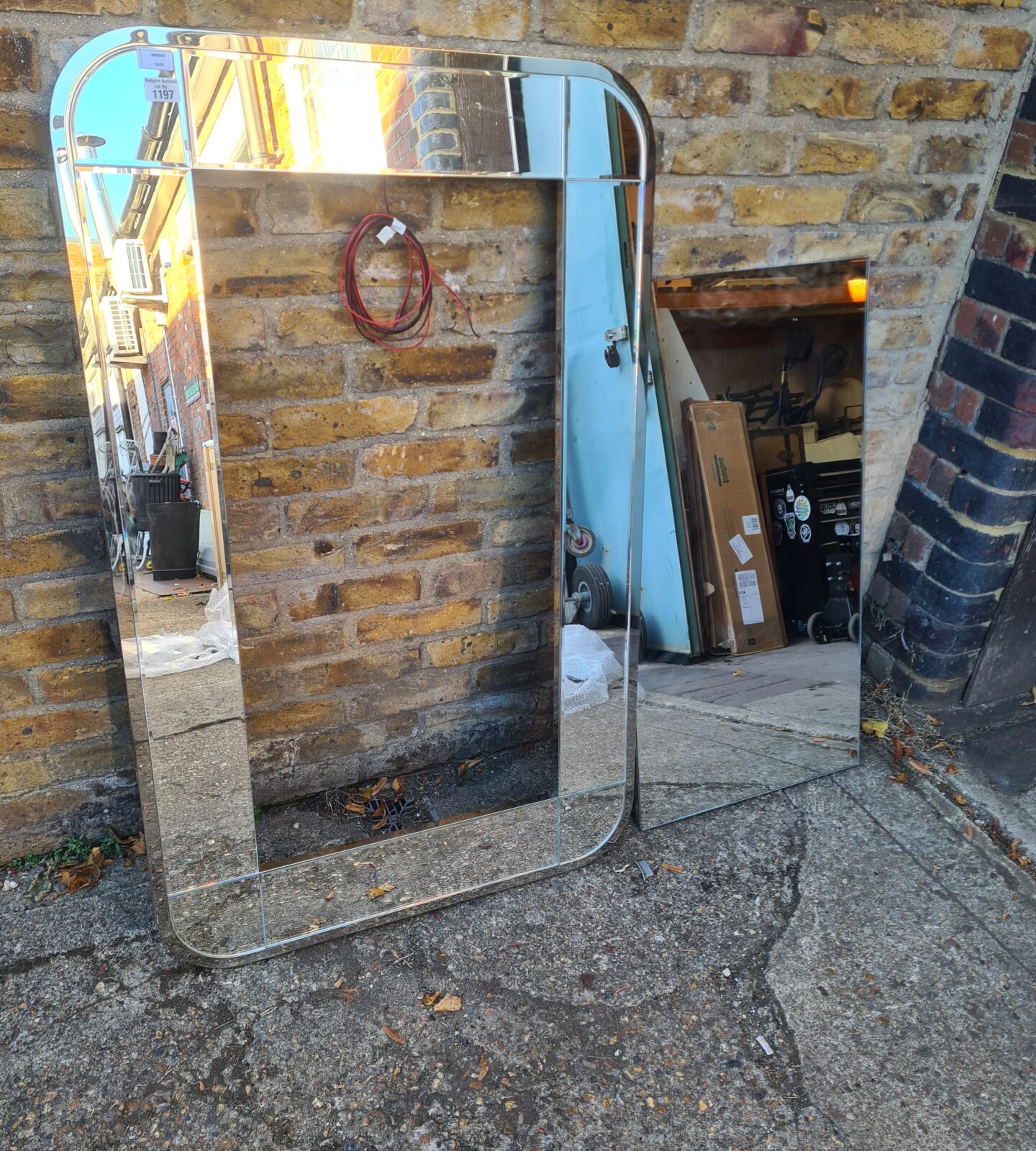 Full length illuminated wall mirror for bathroom or bedroom.