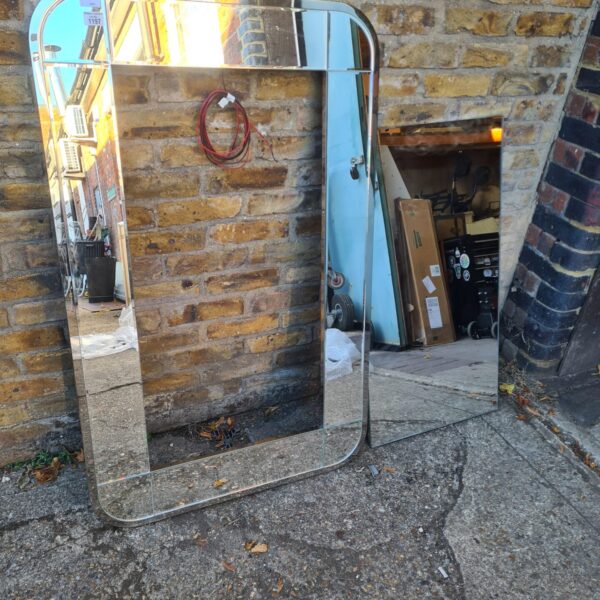 Full length illuminated wall mirror for bathroom or bedroom.