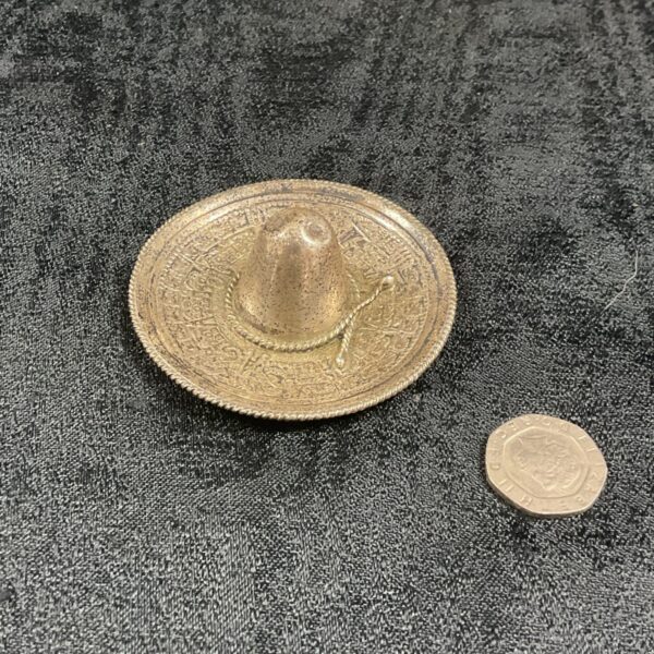 Vintage silver Mexican hat pin tray, detailed craftsmanship.
