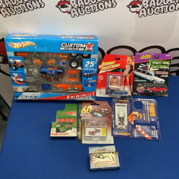 Boxed diecast model cars including Hot Wheels, Corgi and Matchbox.