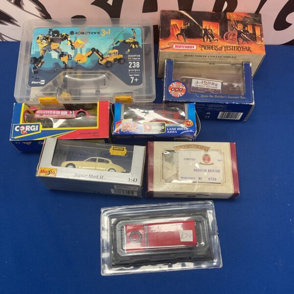 Boxed diecast model selection including Corgi, Matchbox, and Burago vehicles.