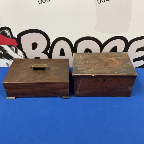 Pair of vintage wooden boxes with aged patina.
