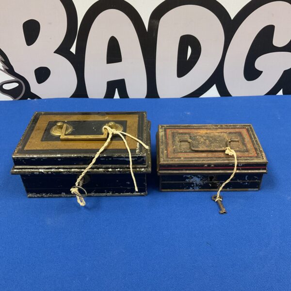 Two vintage lockable tin money boxes with keys