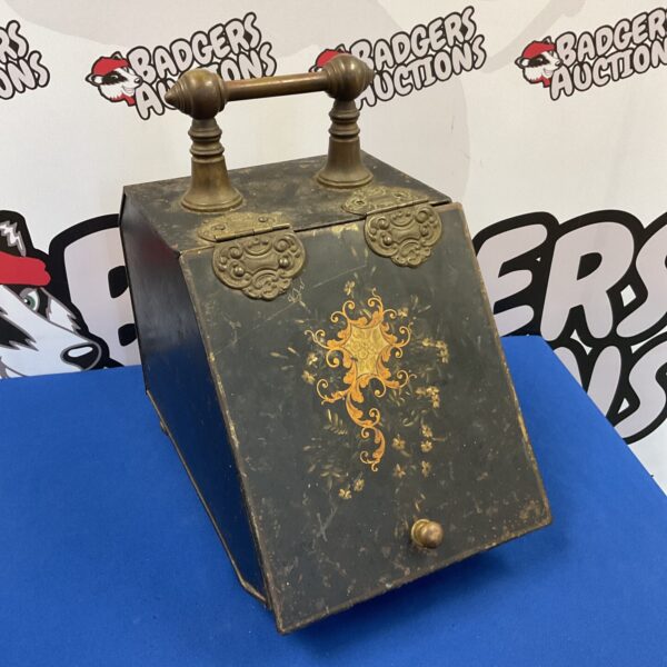 Ornate Victorian coal box with brass accents and hinged lid.