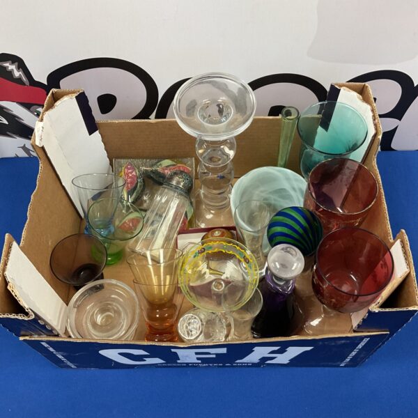 Vibrant art glass collection with colourful goblets and candlesticks.