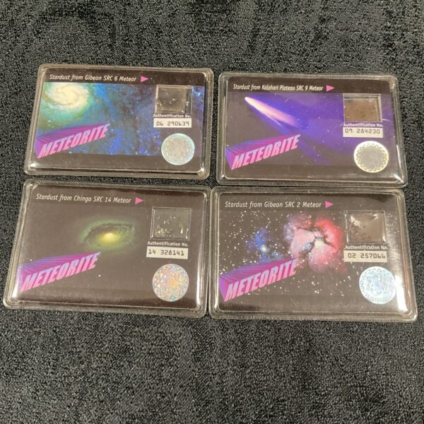 Four authentic meteorite fragments from Space Research in acrylic holders.