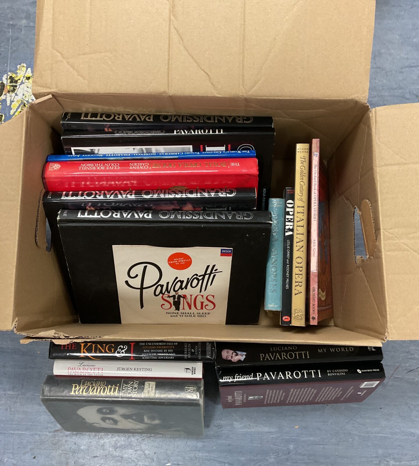 Box of luciano pavarotti books & 7” single vinyl record