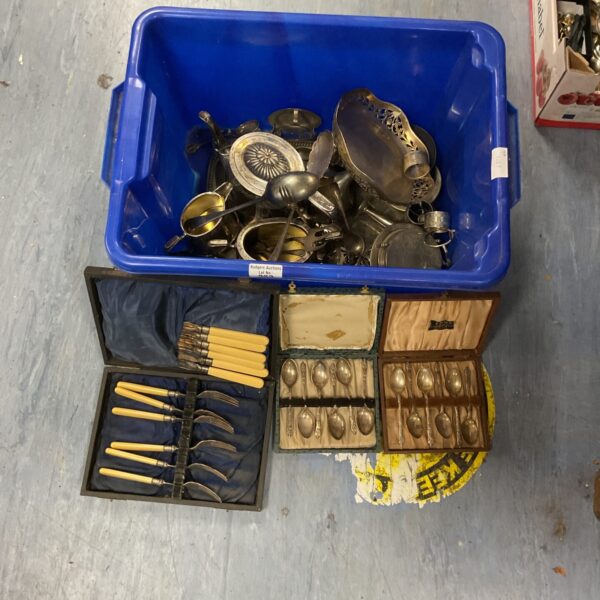 Mixed lot of vintage silverplate cutlery in a blue box.