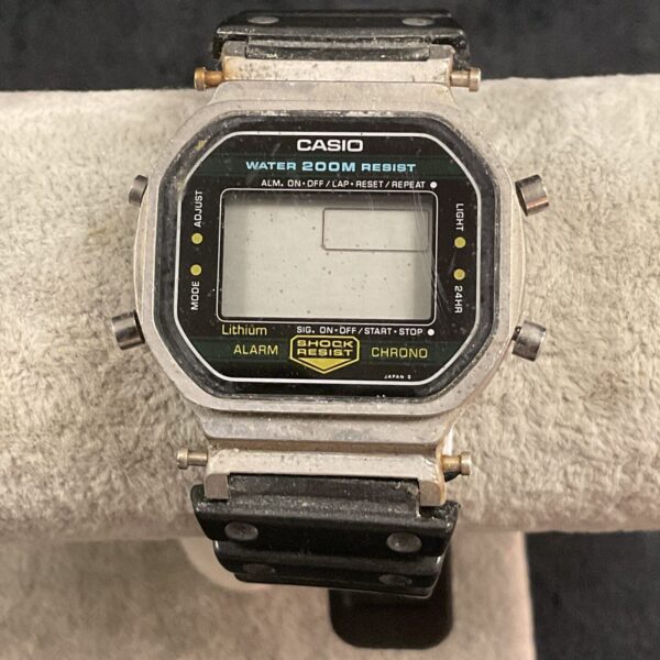 Close-up of vintage Casio digital watch with resin strap.