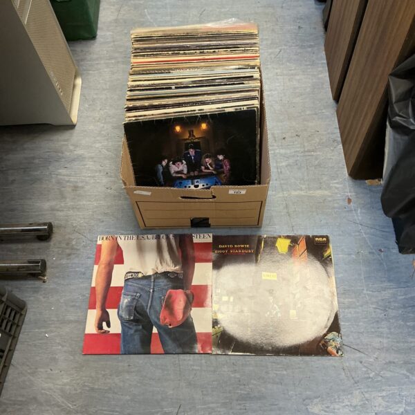 Box of vintage rock vinyl records for collectors.