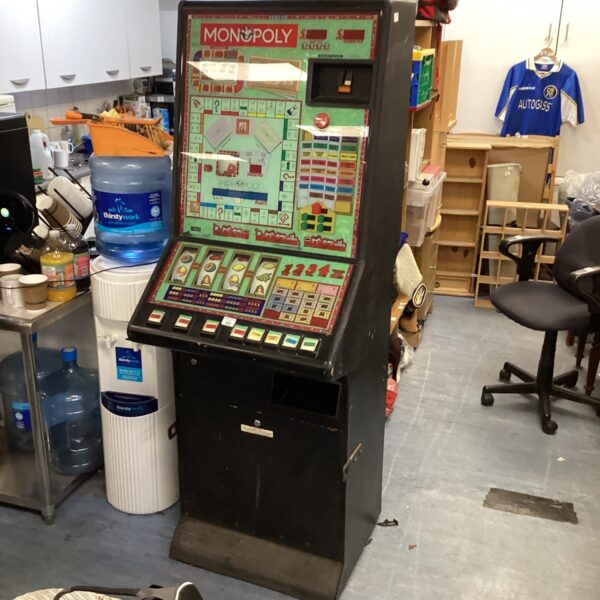 Front view of a vintage Monopoly fruit machine arcade game.