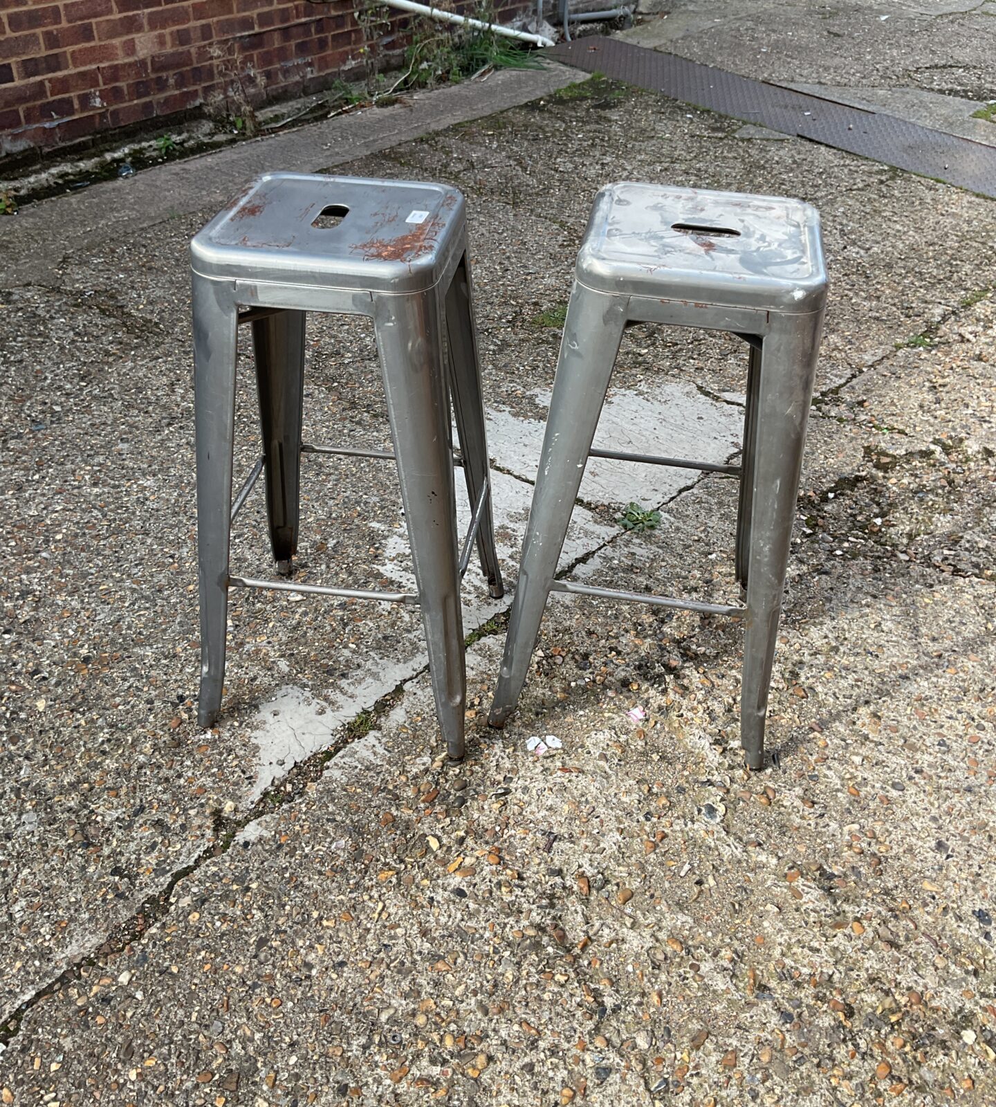 Two metal barstools