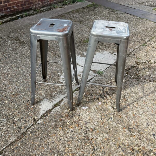 Two metal barstools