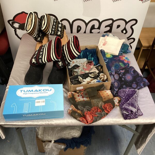 Ladies scarves, Ugg-style boots, and Tumakou spot remover in a mixed lot.