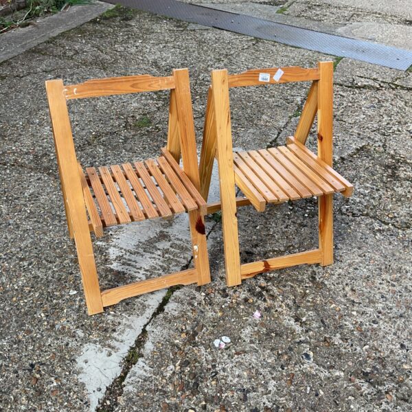 Two wooden folding childrens chairs