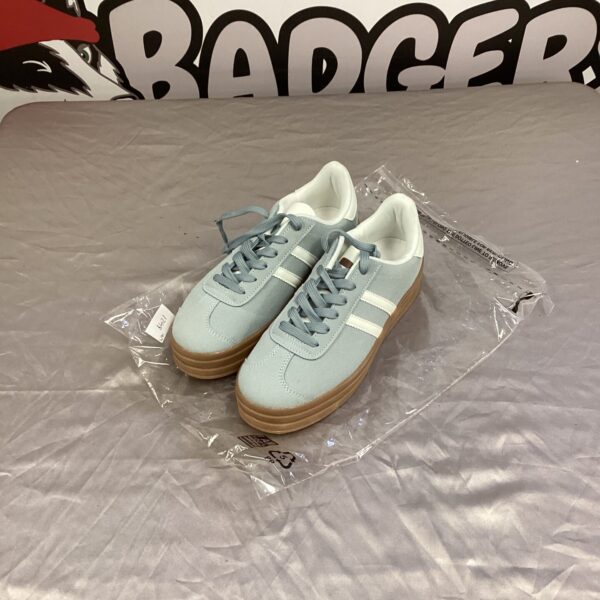 New baby blue size 7 trainers with a retro style.