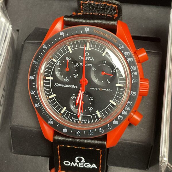 Front view of the red Omega Swatch MoonSwatch Lava watch.