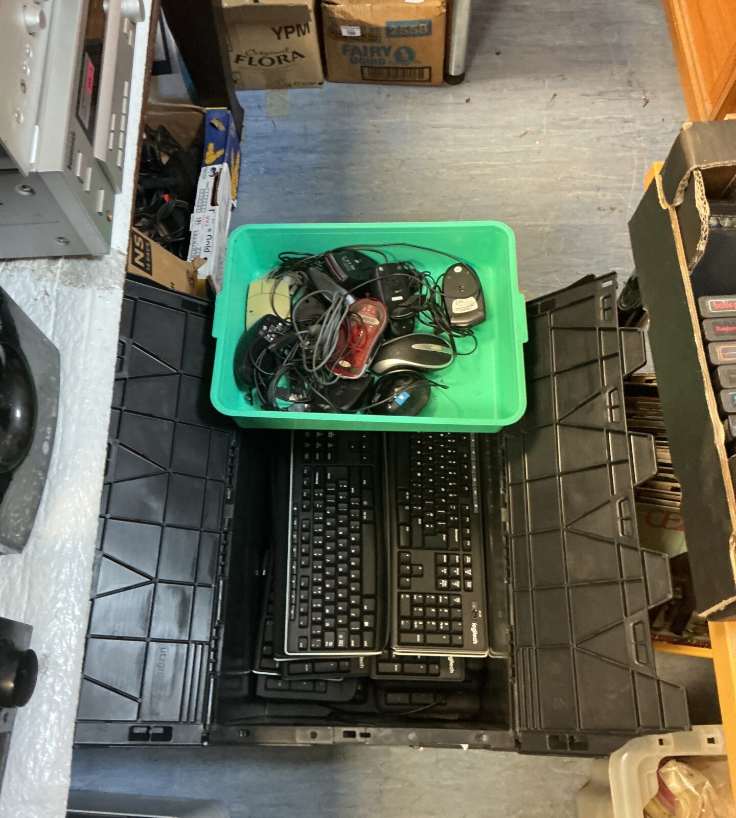 Crate of Logitech keyboards and lot of computer mice