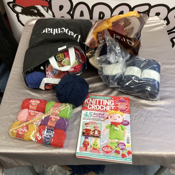 Colourful knitting and crochet wool lot with magazine.