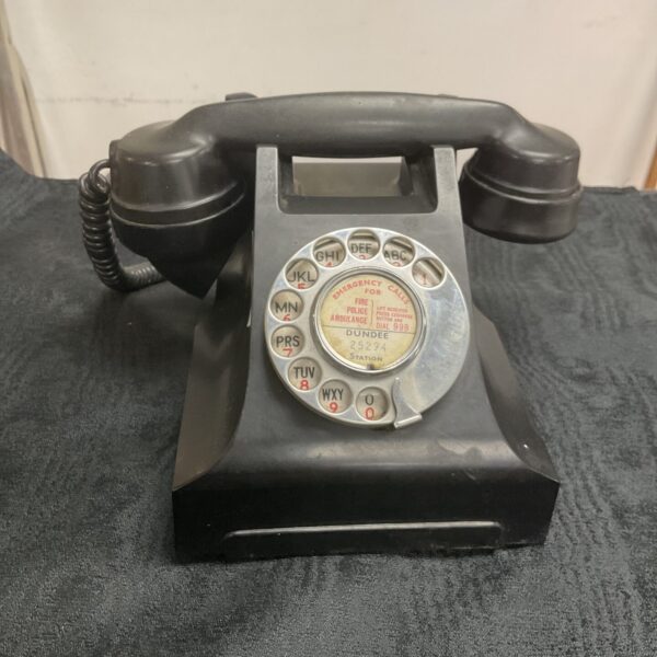 Close-up of a vintage Bakelite GPO 164 telephone.
