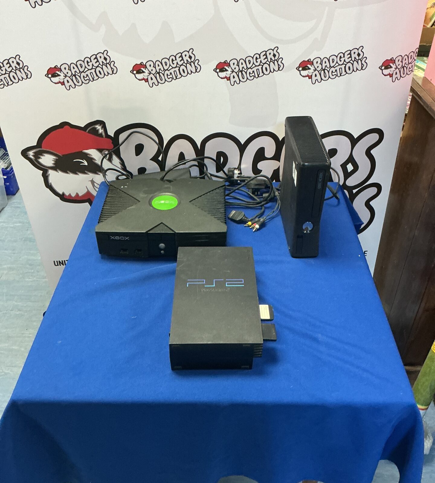 Xbox, Xbox One, and PlayStation 2 consoles (one missing power cord)