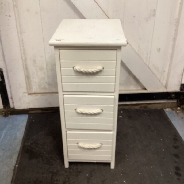 White three-drawer bathroom cabinet for storage.
