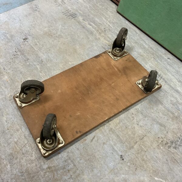 Vintage dolly wheel trolley with four casters.