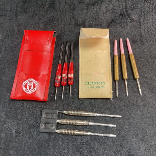 Vintage Manchester United darts set with original packaging.