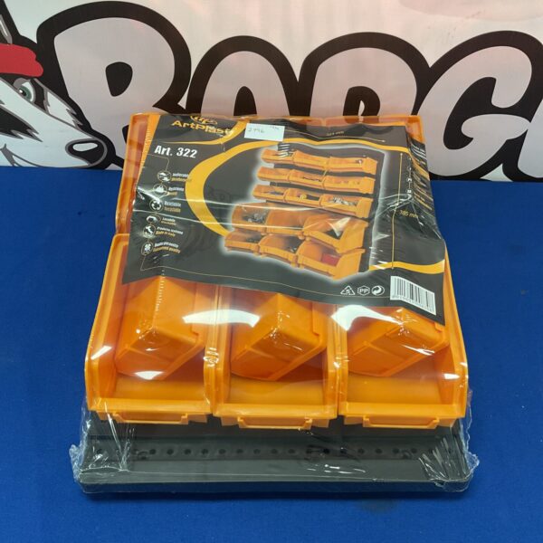 Vintage Artplast wall storage unit for tools and small items.