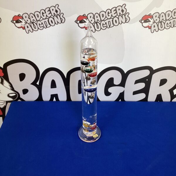 Handmade Galileo thermometer with colourful glass bulbs.