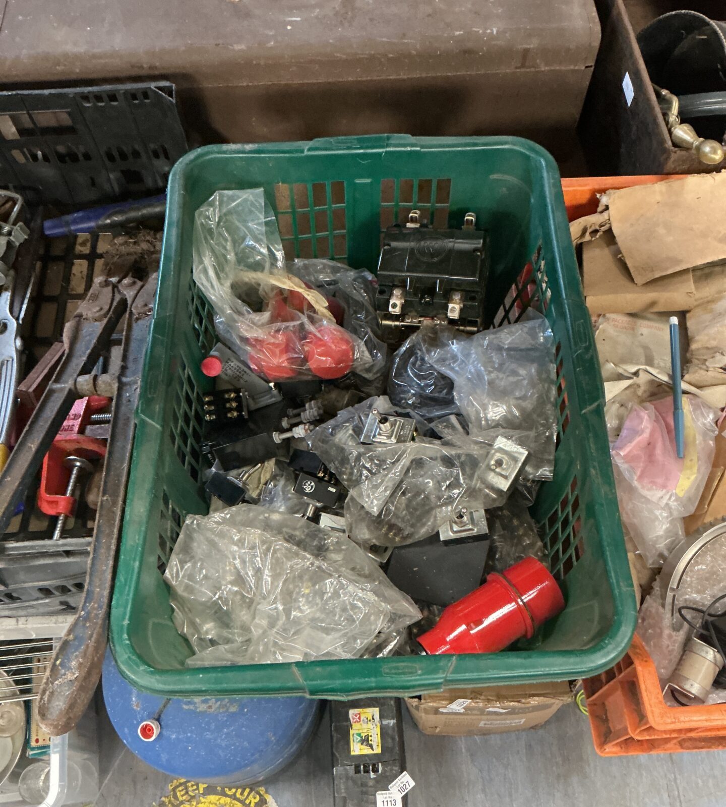 Ox of military spare parts, largely bags of toggle switches