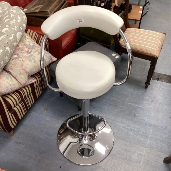 White leather bat stool with chrome base and adjustable height.